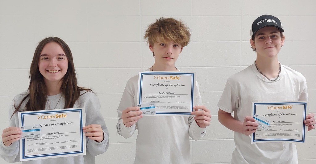 3 Students getting a picture taken with their OSHA Certifications- "CareerSafe presents Certificate of Completion"
